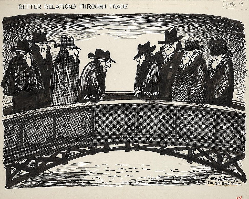Ink cartoon from February 1962 showing two groups of men in hats and overcoats meeting on a bridge, the figures labelled Abel and Powers passing each other, under the title Better Relations Through Trade