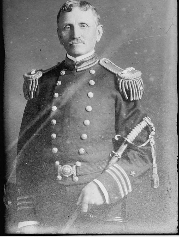 Studio photograph of Rear Admiral William B. Caperton of the US Navy in full dress uniform with epaulettes and sword, around 1915